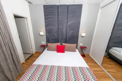 Un ou plusieurs lits dans un hébergement de l'établissement Hôtel Méditerranée