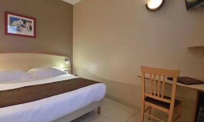 Un ou plusieurs lits dans un hébergement de l'établissement Hotel Tettola