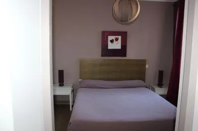Un ou plusieurs lits dans un hébergement de l'établissement Les Orangers