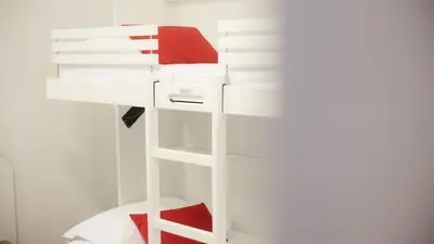 Un ou plusieurs lits superposés dans un hébergement de l'établissement Hôtel Napoléon