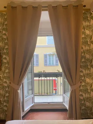 Un ou plusieurs lits dans un hébergement de l'établissement Hotel Central Bastia