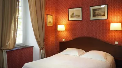 Un ou plusieurs lits dans un hébergement de l'établissement Hotel Central Bastia