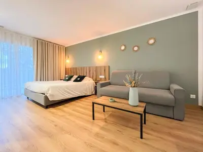 Un ou plusieurs lits dans un hébergement de l'établissement Auberge les Oliviers