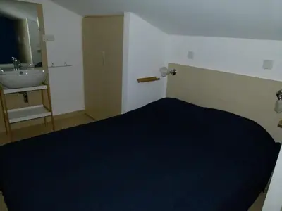Un ou plusieurs lits dans un hébergement de l'établissement T3 Duplex tout confort - piscine - proche plage - 6 personnes