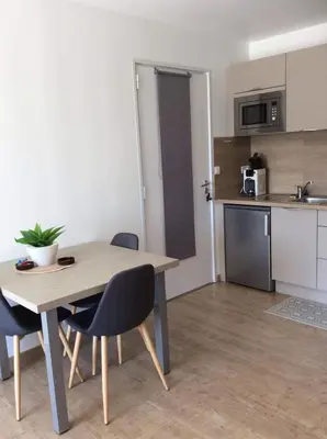 Cuisine ou kitchenette dans l'établissement Au bien être