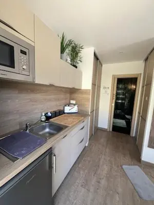 Cuisine ou kitchenette dans l'établissement Au bien être