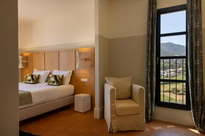 Un ou plusieurs lits dans un hébergement de l'établissement Hôtel Restaurant Villa Joséphine
