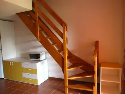 Télévision ou salle de divertissement dans l'établissement Residence de Tourisme Marina Corsa