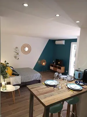 Coin salon dans l'établissement Grand studio 35m2 centre ville