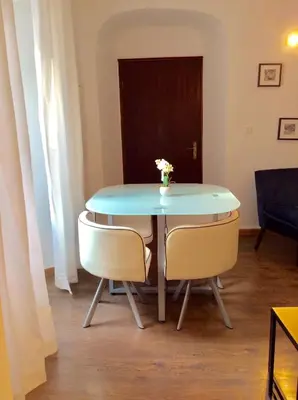 Coin salon dans l'établissement Appartement Doria