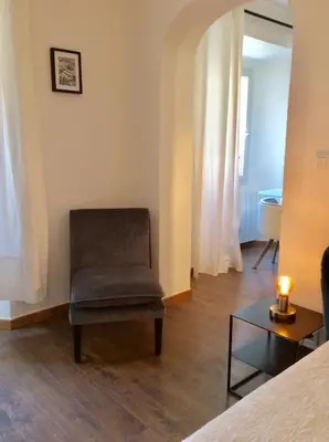 Coin salon dans l'établissement Appartement Doria