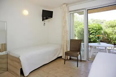 Un ou plusieurs lits dans un hébergement de l'établissement Apartment in Île Rousse near Sandy Beaches