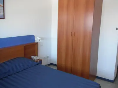 Un ou plusieurs lits dans un hébergement de l'établissement Hôtel Sampiero