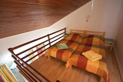Un ou plusieurs lits dans un hébergement de l'établissement FKK-Feriendorf Village naturiste Club Corsicana