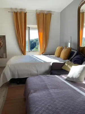 Un ou plusieurs lits dans un hébergement de l'établissement La charmante **** Maison Cap Corse, Tomino