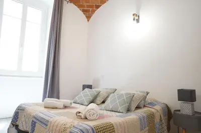 Un ou plusieurs lits dans un hébergement de l'établissement Appartement Gaudin