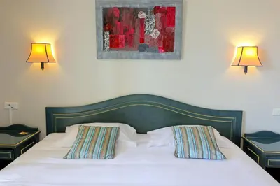 Un ou plusieurs lits dans un hébergement de l'établissement Hotel Saint Christophe
