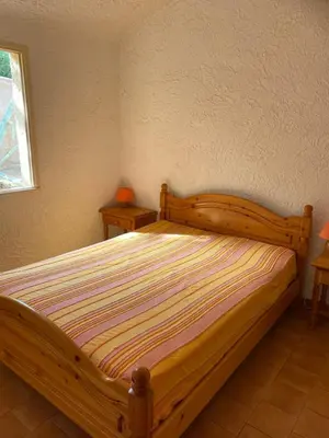 Un ou plusieurs lits dans un hébergement de l'établissement Location 5 personnes Sant Ambroggio Cocody village