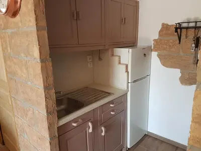Cuisine ou kitchenette dans l'établissement L Appicciu
