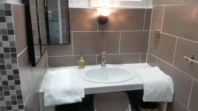 Salle de bains dans l'établissement Le Moulin de l'Ostriconi