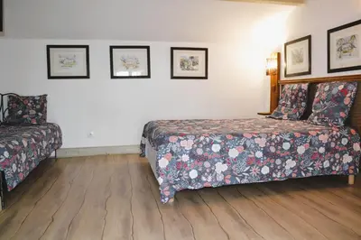 Un ou plusieurs lits dans un hébergement de l'établissement Maison de la Vigne