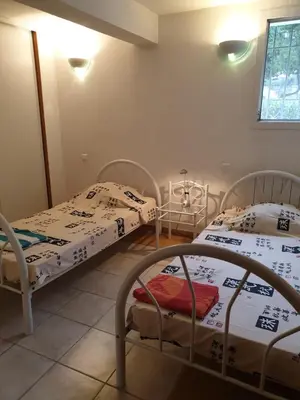 Un ou plusieurs lits dans un hébergement de l'établissement Villa Athena