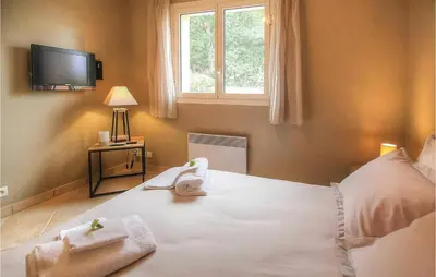 Un ou plusieurs lits dans un hébergement de l'établissement Cozy Home In Algajola With Wifi
