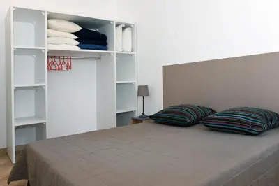 Un ou plusieurs lits dans un hébergement de l'établissement Résidence Cala Bianca