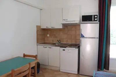 Cuisine ou kitchenette dans l'établissement Résidence Cala Bianca