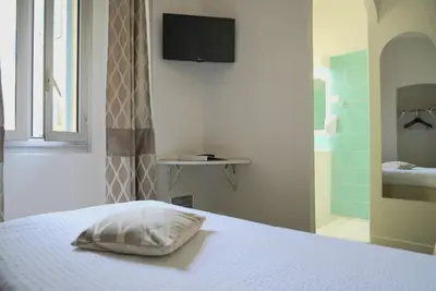 Un ou plusieurs lits dans un hébergement de l'établissement Sud Hôtel Restaurant
