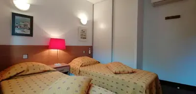 Un ou plusieurs lits dans un hébergement de l'établissement VILLA ANGELINI