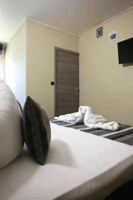 Un ou plusieurs lits dans un hébergement de l'établissement Le Banana's Hotel