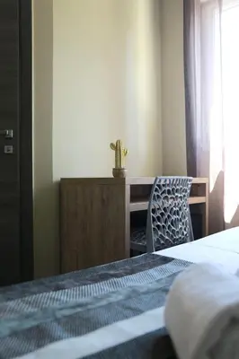 Un ou plusieurs lits dans un hébergement de l'établissement Le Banana's Hotel