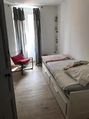 Un ou plusieurs lits dans un hébergement de l'établissement Appartement à Ile Rousse
