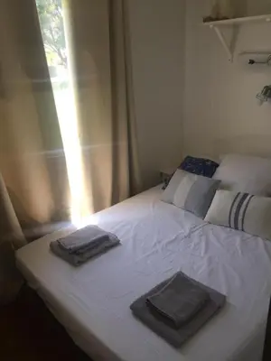 Un ou plusieurs lits dans un hébergement de l'établissement Mobil home climatisé, bord de mer Macinaggio
