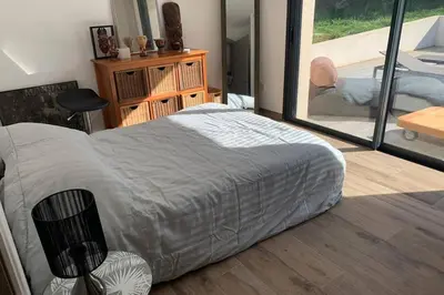 Un ou plusieurs lits dans un hébergement de l'établissement VILLA BENOA