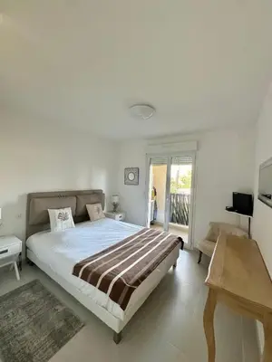 Un ou plusieurs lits dans un hébergement de l'établissement Appartement CUMARU vue mer