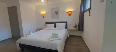 Un ou plusieurs lits dans un hébergement de l'établissement Corse et Zen LOFT ZEN 145m2 8à9 pers