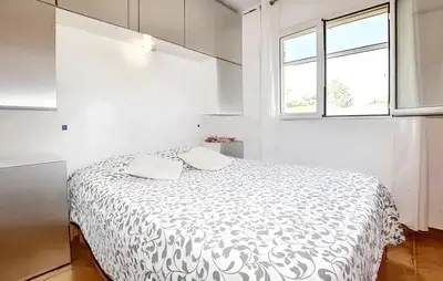 Un ou plusieurs lits dans un hébergement de l'établissement Villa ensoleillée & Piscine privée à Aléria