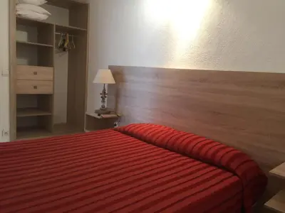 Un ou plusieurs lits dans un hébergement de l'établissement Appart'Hôtel A Punta