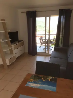 Télévision ou salle de divertissement dans l'établissement Appart'Hôtel A Punta