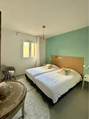 Un ou plusieurs lits dans un hébergement de l'établissement ALOES Appartement T3