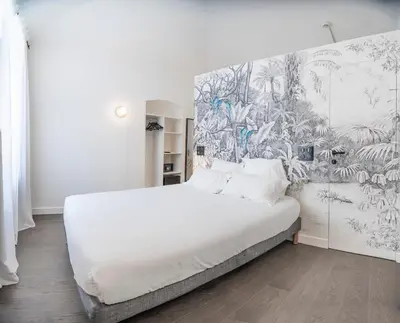 Un ou plusieurs lits dans un hébergement de l'établissement Monsieur Miot Concept Hotel - Bastia centre