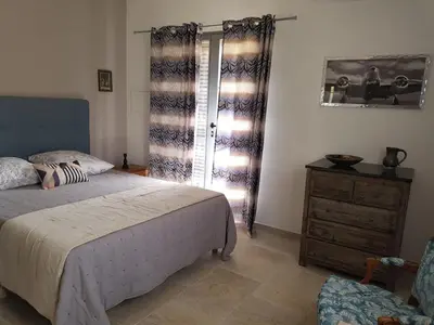 Un ou plusieurs lits dans un hébergement de l'établissement Villa Capraghjese