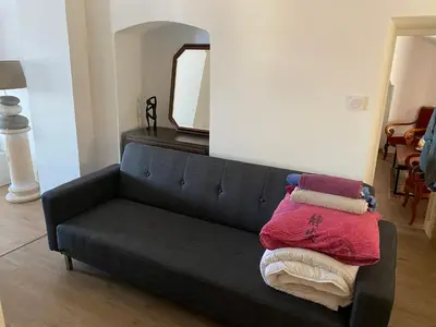 Coin salon dans l'établissement Appartement vue mer et îles italiennes