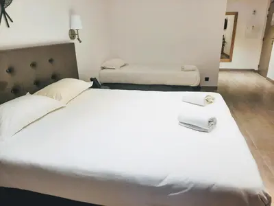 Un ou plusieurs lits dans un hébergement de l'établissement Hôtel Casa Mea