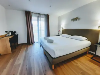 Un ou plusieurs lits dans un hébergement de l'établissement Hôtel Casa Mea