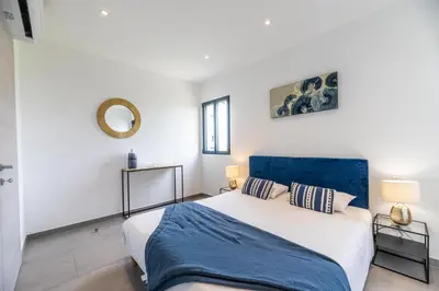 Un ou plusieurs lits dans un hébergement de l'établissement Casa u fornu Residence & Spa