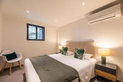 Un ou plusieurs lits dans un hébergement de l'établissement Casa u fornu Residence & Spa
