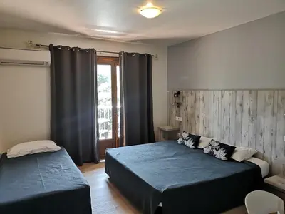 Un ou plusieurs lits dans un hébergement de l'établissement Hotel Cyrnea